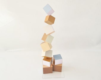 Wood sculpture in neutral colors, hand painted cubes each side in a different color. Decorative art sculpture, geometric design, modern deco