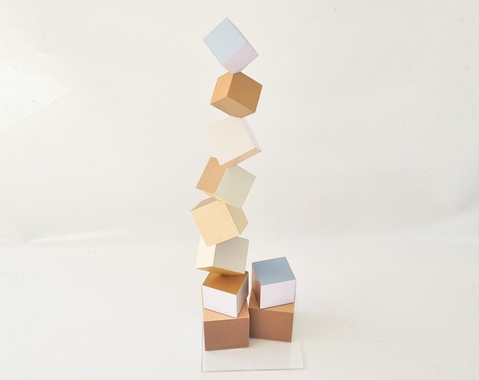 Wood sculpture in neutral colors, hand painted cubes each side in a different color. Decorative art sculpture, geometric design, modern deco