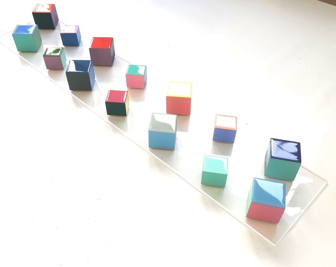 Narrow and long wood wall art. Geometric and colorful wood cubes. Happy colors. Modern 3D art. Wooden wall art with resin on the top face ©