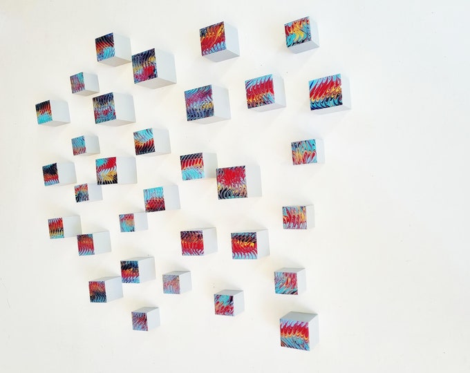 Set of hand-painted wooden cubes, each of the blocks has a glossy resin coating on the front face. You can choose the number of cubes ©
