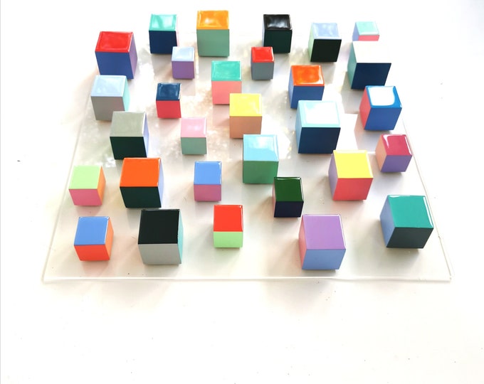 Geometric 3d wall art. Modern wall sculpture. Wood wall art with resin finish on top face. Happy and bold colors. Eye-catching colors. ©