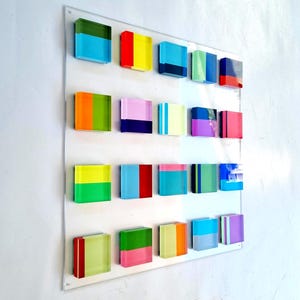 Hand painted acrylic blocks on transparente acrylic base. (Perspex)
Geometric 3D art. Happy and bold colors.