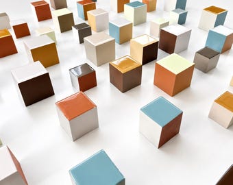 Wood art installation in neutral, natural soft colors. 3d cube art. Hand painted blocks whit shiny epoxy resin front face.