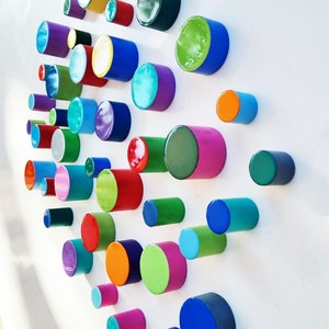 PACKS of hand painted colored cylinders with high quality,shiny epoxy resin front face.Choose the number of Self install wall art Cylinders©