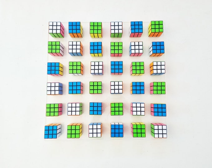 Magic cube puzzle wall piece Unique Rubiks Cube wall art. ©. Original retro vintage toy Rubik cube art piece. 80s nostalgia puzzle picture