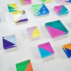 Hand painted transparent acrylic blocks.