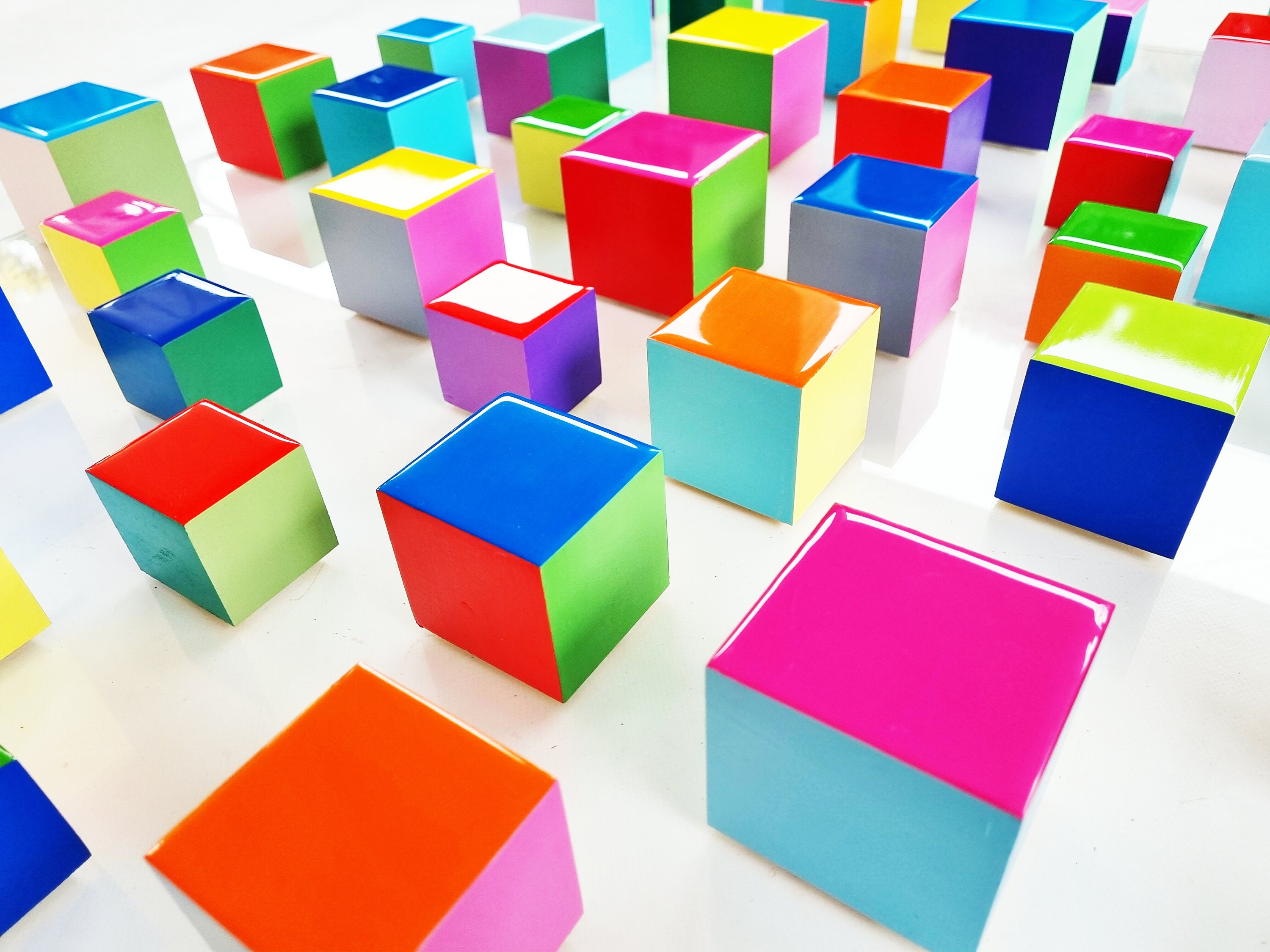 PACKS of hand painted colored wooden cubes with high quality,shiny epoxy resin front face.Choose the number of Self install wall art cubes ©
