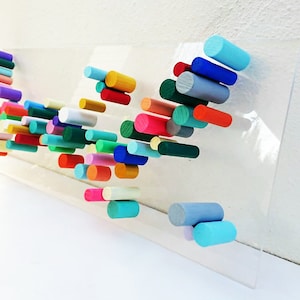 Original and modern wood wall sculpture. Rectangular wood wall art. Floating transparent base. 3D art. Colorful Hand-painted wooden pegs