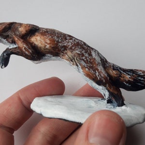 Fox in the snow sculpture