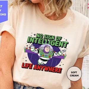 a woman wearing a t - shirt that says, no sign of intelligent life anywhere