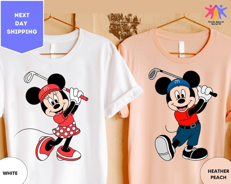 a couple of mickey mouse shirts hanging on a wall
