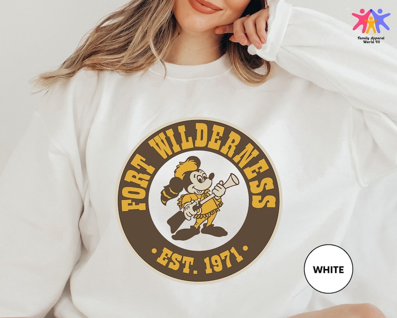 a woman wearing a white shirt with a logo on it