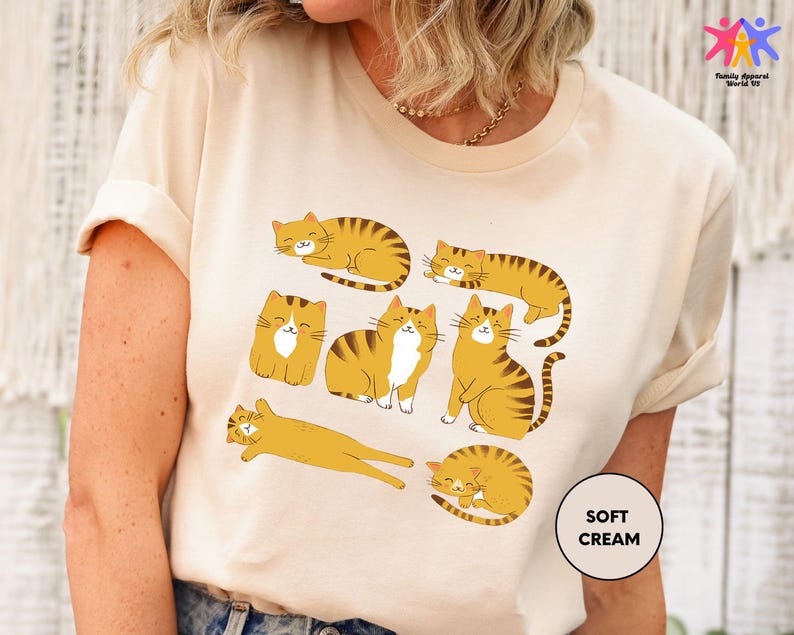 a woman wearing a t - shirt with cats on it