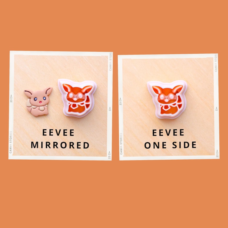 May include: Two Eevee-themed charms, one mirrored and one single-sided, displayed on a light wooden surface. The mirrored charm features a pink and brown design, while the single-sided charm is orange and white. Text reads "EEVEE MIRRORED" and "EEVEE ONE SIDE."
