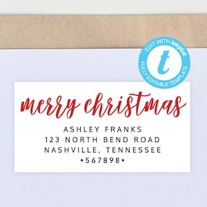 May include: A white rectangular label with the words "merry christmas" in red script. Below, the name "ASHLEY FRANKS" and address details are printed in black. A blue circle with white text reads "EDIT WITH TEMPLETT".