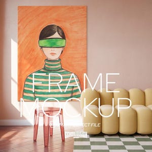 May include: An orange framed artwork with a person wearing a green blindfold and a green and white striped turtleneck. A transparent red stool, a yellow sofa, and a green and white checkered rug are also in the room. The text "FRAME MOCKUP" is displayed.