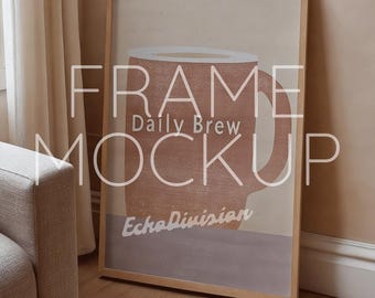 May include: A framed print with a minimalist design of a coffee mug in shades of brown and beige. The text "Daily Brew" and "Echo Division" are printed on the print.
