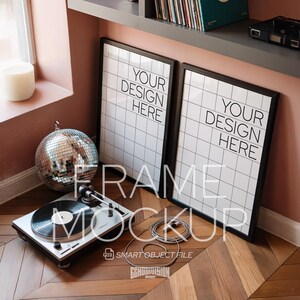 May include: A mockup featuring two black framed prints with the text "YOUR DESIGN HERE" on a grid pattern. A turntable, disco ball, and cable are in front. The text "FRAME MOCKUP" and "SMART OBJECT FILE" are also visible.