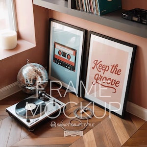 May include: A stylish room setup with a turntable, framed art prints, and a disco ball. The prints feature a cassette tape and the words "Keep the groove." The room has a warm colour palette and a wooden floor.