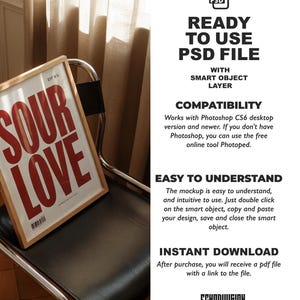 May include: A framed print with the words "SOUR LOVE" in large red letters. The frame is light brown, and the print is propped on a black chair. The image also includes text about a PSD file with a smart object layer.