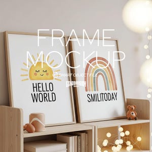 May include: Two framed art prints with a light wood frame. One print features a smiling sun with the words "Hello World". The other print shows a rainbow with the words "Smilitoday". The prints are displayed on a wooden shelf.