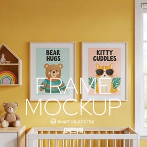 May include: Two framed art prints with the phrases "Bear Hugs" and "Kitty Cuddles" are displayed on a yellow wall. The "Bear Hugs" print features a cartoon bear wearing a sweater. The "Kitty Cuddles" print shows a cat wearing sunglasses. A crib and a teddy bear are in the foreground.