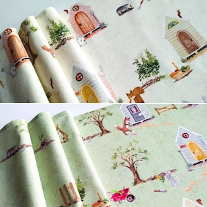 May include: Two fabric swatches with a repeating pattern of houses, animals, and trees. The top swatch is a light beige with a brown, green, and red pattern. The bottom swatch is a light green with a brown, green, and red pattern.