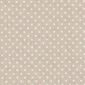 May include: A beige fabric with a white polka dot pattern. The fabric has a subtle texture.
