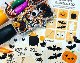May include: A set of Halloween themed play dough tools and cards for kids. The cards feature words like "monster eyes", "spell", "broom stick", "stick", "bat", and "pumpkin spice". The play dough tools include a cauldron, a pumpkin, a bat, a spider, and a skeleton.