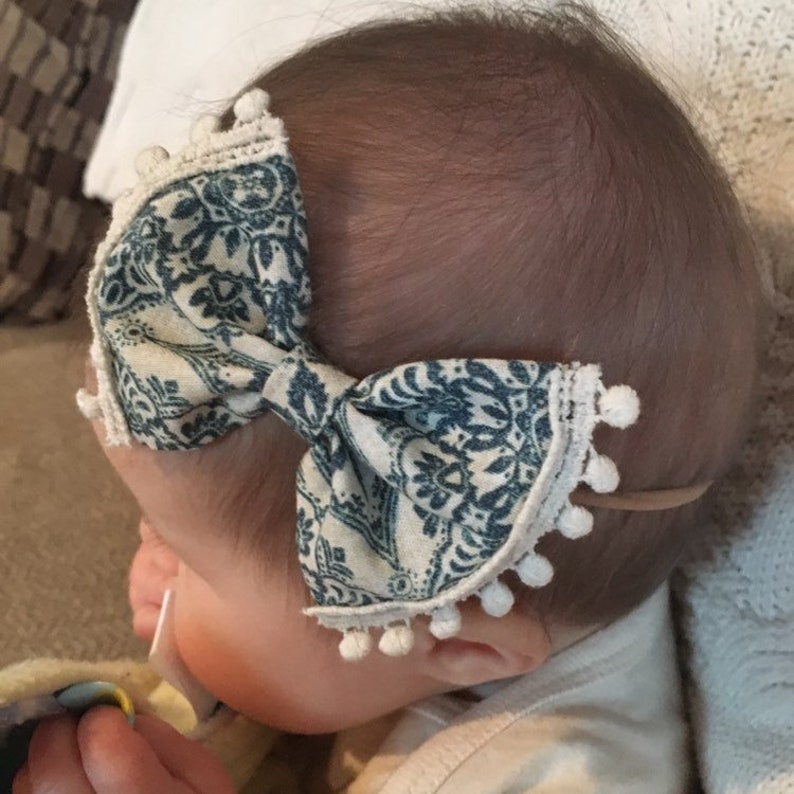 Blue paisley with pom pom fringe bow