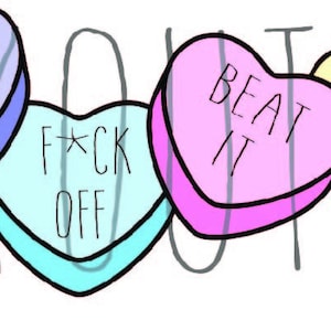 May include: Four heart-shaped candy conversation hearts with different messages. The hearts are purple, blue, pink, and yellow. The messages are "Go Away", "F*ck Off", "Beat It", and "Hell No".