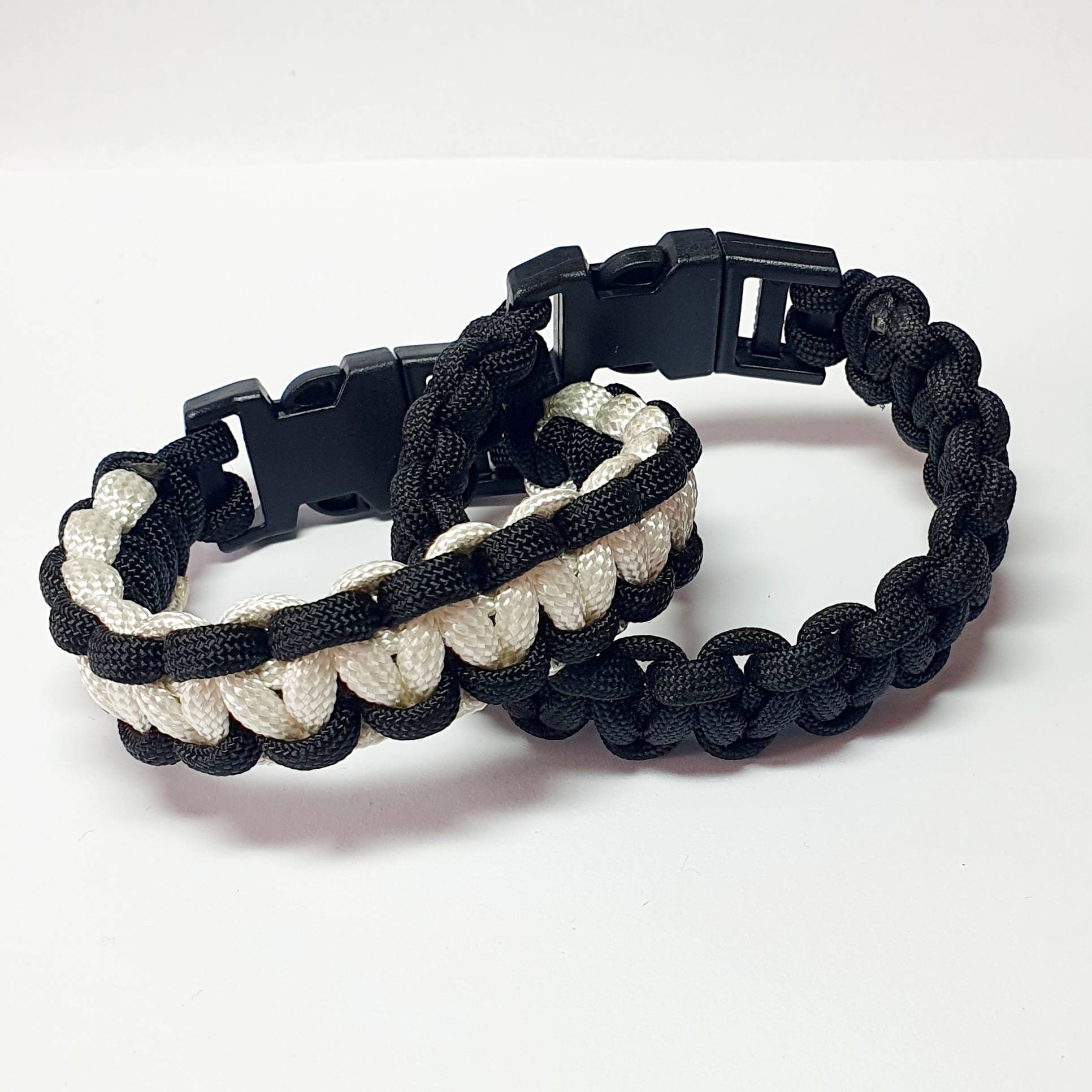 Black & White and Black 550 Paracord Bracelet Set. Made by the Art of