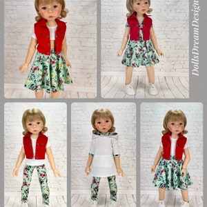 May include: A doll wearing a red vest, white shirt, and a green floral skirt. The doll is standing on a white brick background. The doll is wearing white sneakers. The doll has blonde hair and blue eyes.