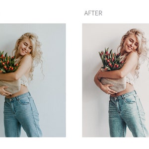 May include: A woman with blonde curly hair is holding a bouquet of red tulips in a woven basket. She is wearing a white crochet top and blue jeans. The background is a white wall.