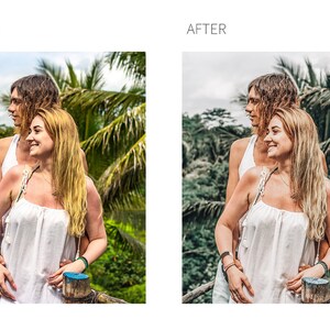 May include: Two people stand close together in a tropical setting. They are both wearing white tank tops and have long hair. The woman on the right is smiling. The background is a lush green forest with palm trees.