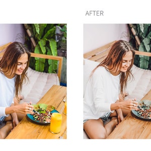 May include: A woman sits at a wooden table, eating a salad with a fork. She is wearing a white long-sleeved shirt and denim shorts. There is a glass of orange juice on the table next to her plate.