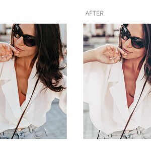 May include: A woman wearing a white button-down shirt with a brown leather strap and a pair of black sunglasses. She is wearing blue jeans and has her hand on her chin.
