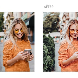 May include: A woman wearing a bright orange sweater and yellow sunglasses is looking at her phone while holding a cup of coffee. She is standing on a city street with trees and buildings in the background.