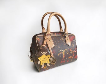 PIERO GUIDI Magic Circus collection woman pvc leather top handle bag.