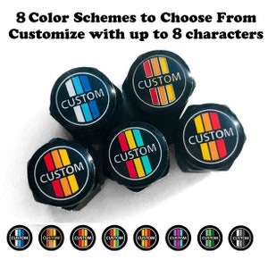 May include: Eight different color schemes for custom tire valve stem caps. Each cap features the word "CUSTOM" in white lettering with a black background and a colorful stripe design.