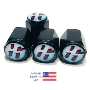 May include: Set of four black tire valve stem caps with a white and red Toyota logo.