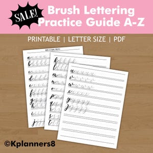 May include: A printable PDF brush lettering practice guide featuring three white sheets with black cursive alphabet letters from A to Z on lined paper. The top banner includes the text Brush Lettering Practice Guide A-Z, SALE, and PRINTABLE | LETTER SIZE | PDF.