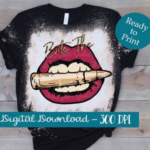 May include: A black t-shirt with a bleached design of a red mouth biting a gold bullet. The text "Bite The" is written in gold glitter above the mouth. The text "Digital Download - 300 DPI" is written in white on a teal background at the bottom of the image.