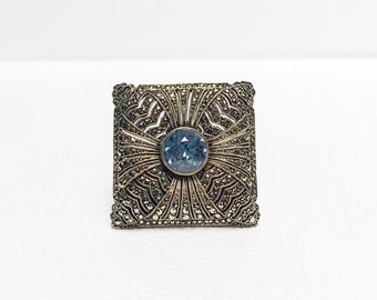 Antique Art Deco 830 silver brooch, with marcasites and blue topaz