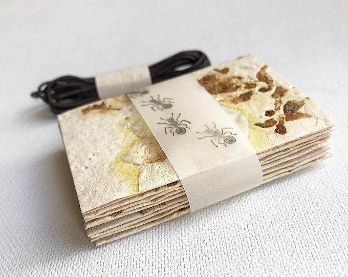 scooped paper /tags, with flowers paper recycling / handmade / scrapbooking and sketching / collage