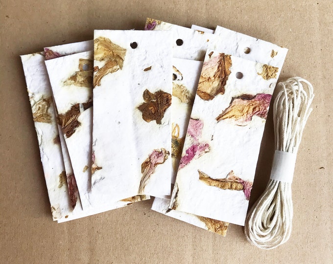 scooped paper /tags, with flowers paper recycling / handmade / scrapbooking and sketching / collage