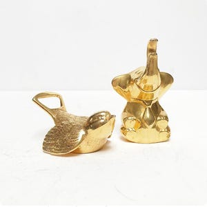 Vintage BMF flesopener / doppenopener / vogel of olifant / verguld / staaf / Mid Century / goud
