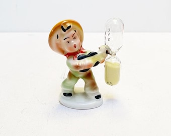 Antique Art Deco porcelain figurine with hourglass, Mexican man with sombrero, made in Germany