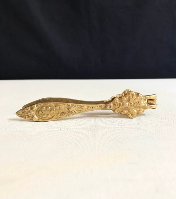 Vintage nutcracker, brass / gold colored baroque style