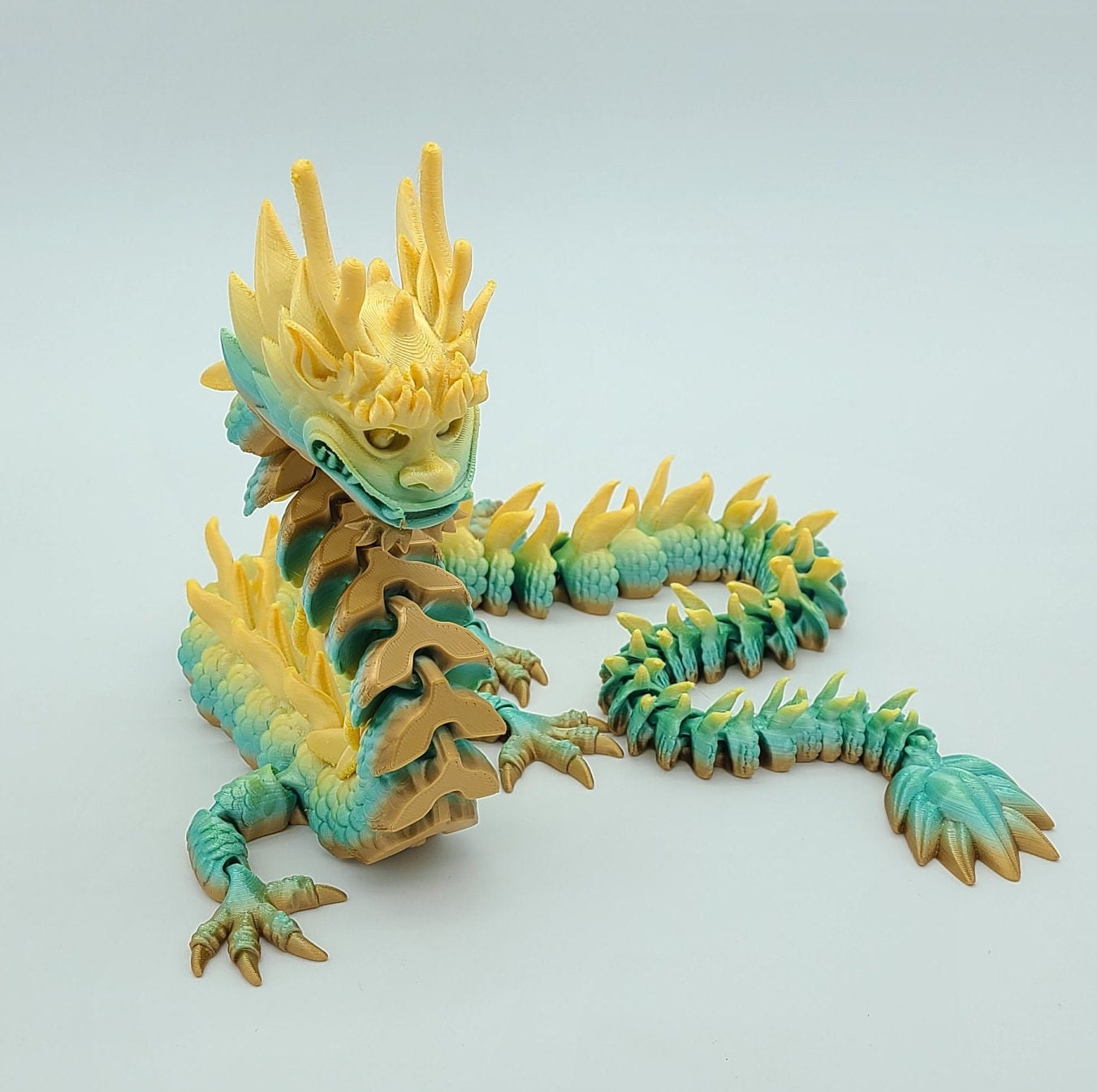 STL file Articulated Pyro, our cute flexi dragon fidget toy, its